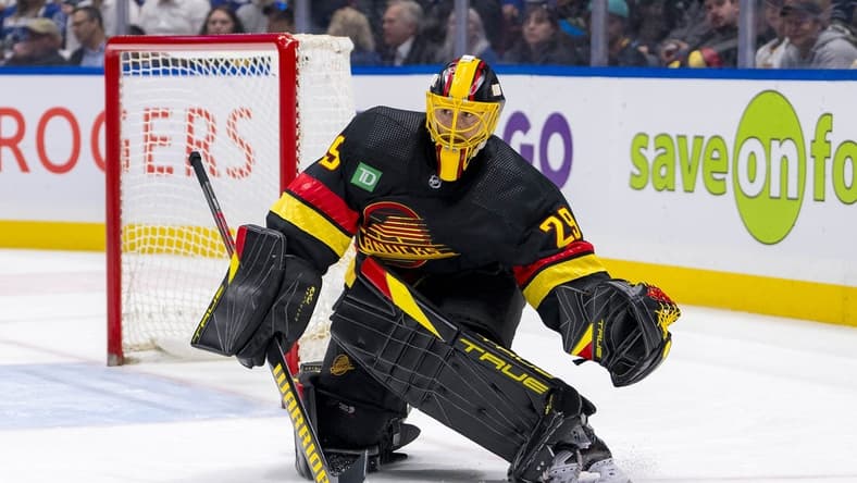 Mar 19, 2024; Vancouver, British Columbia, CAN; Vancouver Canucks goalie Casey DeSmith (29) handles the puck against the Buffalo Sabres in the second period at Rogers Arena. Mandatory Credit: Bob Frid-USA TODAY Sports