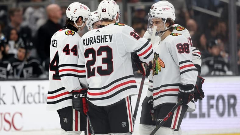 Mar 19, 2024; Los Angeles, California, USA;  Chicago Blackhawks defenseman Wyatt Kaiser (44) and center Philipp Kurashev (23) and center Connor Bedard (98) on the ice during the third period against the Los Angeles Kings at Crypto.com Arena. Mandatory Credit: Kiyoshi Mio-USA TODAY Sports