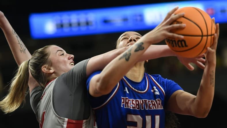 Bryanna Brady of Presbyterian is fouled going for a shot against Sacred Heart in the NCAA Women's Basketball Tournament in Columbia.
