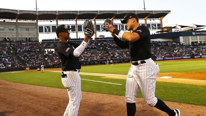 Mar 20, 2024; Tampa, Florida, USA; New York Yankees left fielder Juan Soto (22) and right fielder Aaron Judge (99) high five against the Pittsburgh Pirates at George M. Steinbrenner Field. Mandatory Credit: Kim Klement Neitzel-USA TODAY Sports