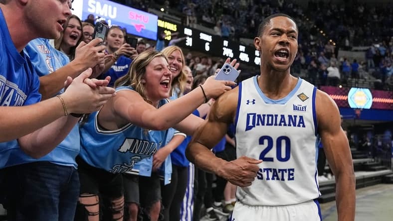 Indiana State Sycamores guard Jayson Kent (20) yells in excitement with fans Wednesday, March 20, 2024, after defeating Southern Methodist Mustangs in the first round of the NIT at the Hulman Center in Terre Haute. The Indiana State Sycamores defeated the Southern Methodist Mustangs, 101-92.
