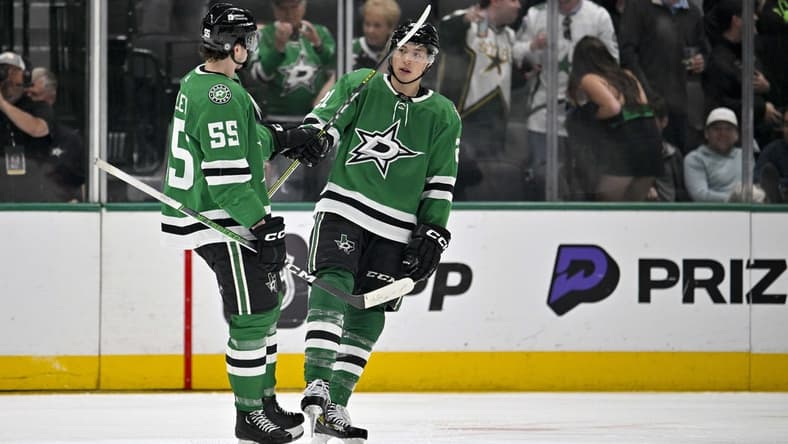 Mar 20, 2024; Dallas, Texas, USA; Dallas Stars defenseman Thomas Harley (55) and left wing Jason Robertson (21) celebrates a goal scored by Robertson against the Arizona Coyotes during the third period at the American Airlines Center. Mandatory Credit: Jerome Miron-USA TODAY Sports