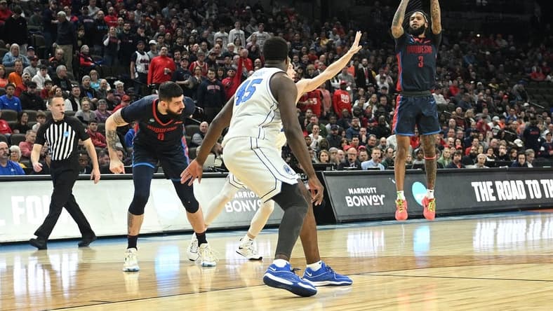 Mar 21, 2024; Omaha, NE, USA;  Duquesne Dukes guard Dae Dae Grant (3) shoots during the first half against the Brigham Young Cougars during the first round of the NCAA Tournament at CHI Health Center Omaha. Mandatory Credit: Steven Branscombe-USA TODAY Sports