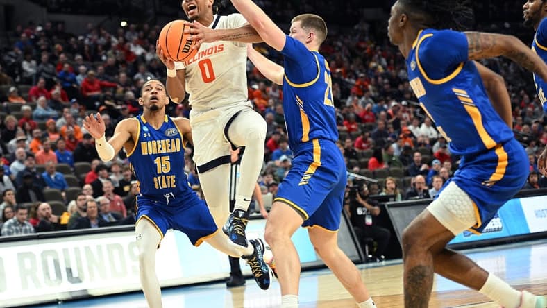 Mar 21, 2024; Omaha, NE, USA; Illinois Fighting Illini guard Terrence Shannon Jr. (0) drives against Morehead State Eagles guard Riley Minix (22) in the first half during the first round of the NCAA Tournament at CHI Health Center Omaha. Mandatory Credit: Steven Branscombe-USA TODAY Sports