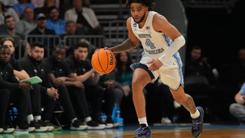 March 21, 2024, Charlotte, NC, USA; North Carolina Tar Heels guard RJ Davis (4) controls the ball against the Wagner Seahawks in the first round of the 2024 NCAA Tournament at the Spectrum Center. Mandatory Credit: Jim Dedmon-USA TODAY Sports