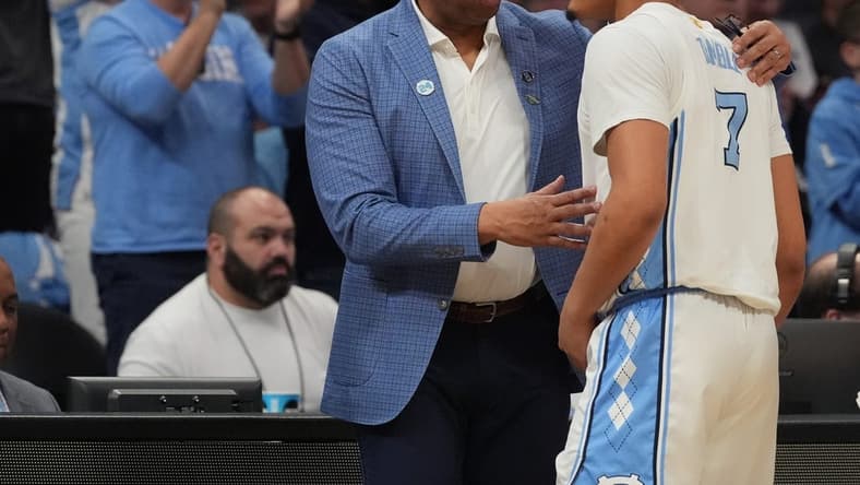 March 21, 2024, Charlotte, NC, USA;  North Carolina Tar Heels head coach Hubert Davis talks with guard Seth Trimble (7) as they play against the Wagner Seahawks in the first round of the 2024 NCAA Tournament at the Spectrum Center. Mandatory Credit: Jim Dedmon-USA TODAY Sports