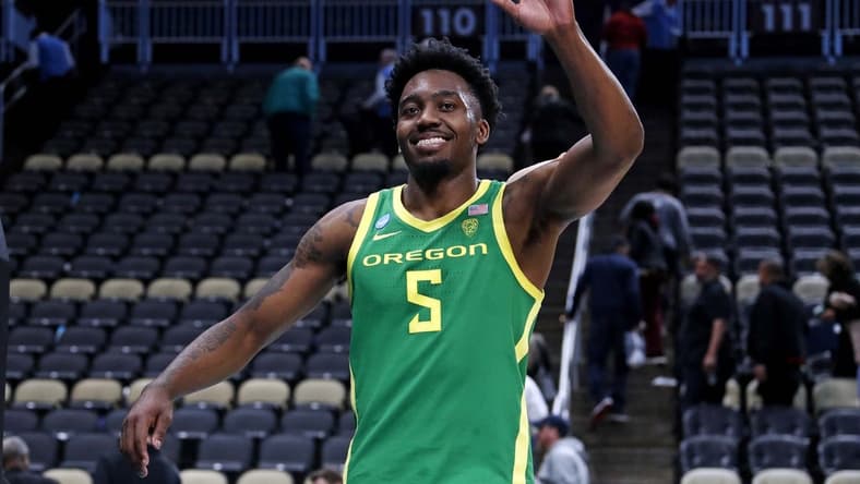 Mar 21, 2024; Pittsburgh, PA, USA; Oregon Ducks guard Jermaine Couisnard (5) waves as he walks off the court after the Oregon Ducks beat the South Carolina Gamecocks in the first round of the 2024 NCAA Tournament at PPG Paints Arena. Mandatory Credit: Charles LeClaire-USA TODAY Sports