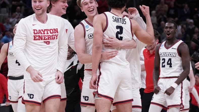 Mar 21, 2024; Salt Lake City, UT, USA; The Dayton Flyers celebrate the win against Nevada Wolf Pack after the second half in the first round of the 2024 NCAA Tournament at Vivint Smart Home Arena-Delta Center. Mandatory Credit: Gabriel Mayberry-USA TODAY Sports
