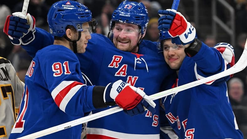 Mar 21, 2024; Boston, Massachusetts, USA; New York Rangers left wing Artemi Panarin (10) celebrates with left wing Alexis Lafreniere (13) and center Alex Wennberg (91) after scoring a goal against the Boston Bruins during the second period at the TD Garden. Mandatory Credit: Brian Fluharty-USA TODAY Sports