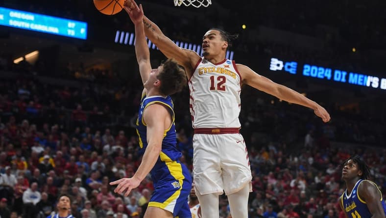 South Dakota State's guard Kalen Garry (10) is blocked by Iowa State's forward Robert Jones (12) during the first half on Thursday, March 21, 2024 at the CHI Health Center in Omaha, Nebraska.