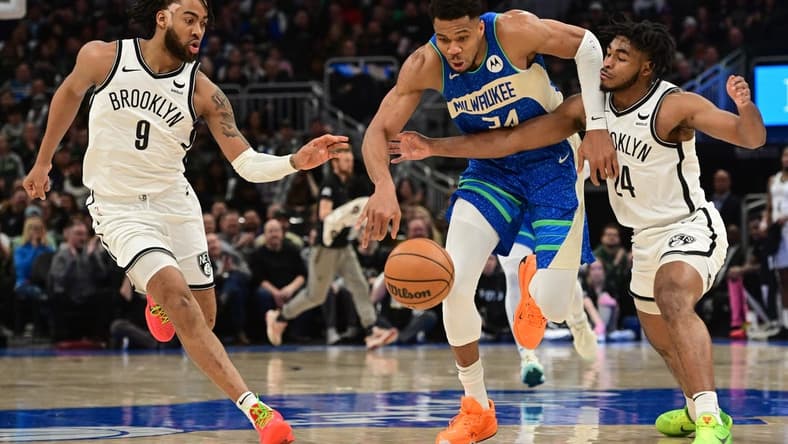 Mar 21, 2024; Milwaukee, Wisconsin, USA; Milwaukee Bucks forward Giannis Antetokounmpo (34) drives for the basket between Brooklyn Nets forward Trendon Watford (9) and guard Cameron Thomas (24) in the second quarter at Fiserv Forum. Mandatory Credit: Benny Sieu-USA TODAY Sports