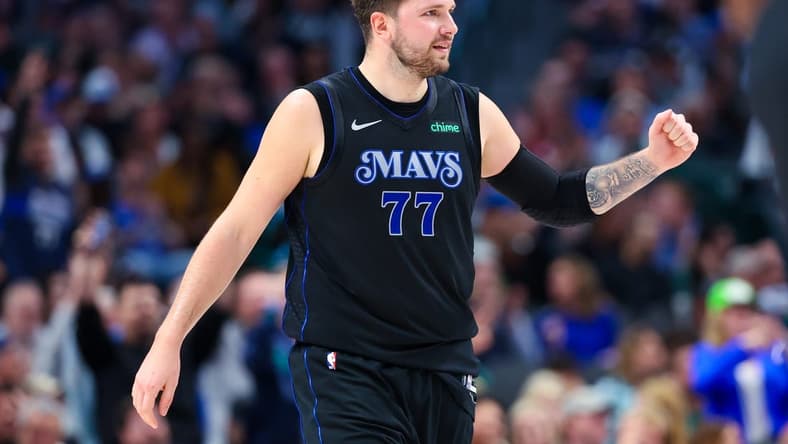 Mar 21, 2024; Dallas, Texas, USA; Dallas Mavericks guard Luka Doncic (77) reacts during the first half against the Utah Jazz at American Airlines Center. Mandatory Credit: Kevin Jairaj-USA TODAY Sports