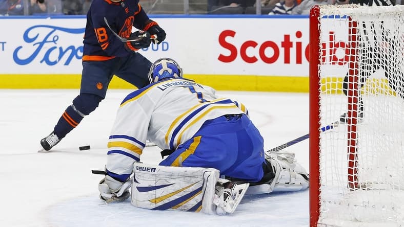 Mar 21, 2024; Edmonton, Alberta, CAN; Buffalo Sabres goaltender Ukko-Pekka Luukkonen (1) makes a save on  on Edmonton Oilers forward Zach Hyman (18) during the first period. at Rogers Place. Mandatory Credit: Perry Nelson-USA TODAY Sports