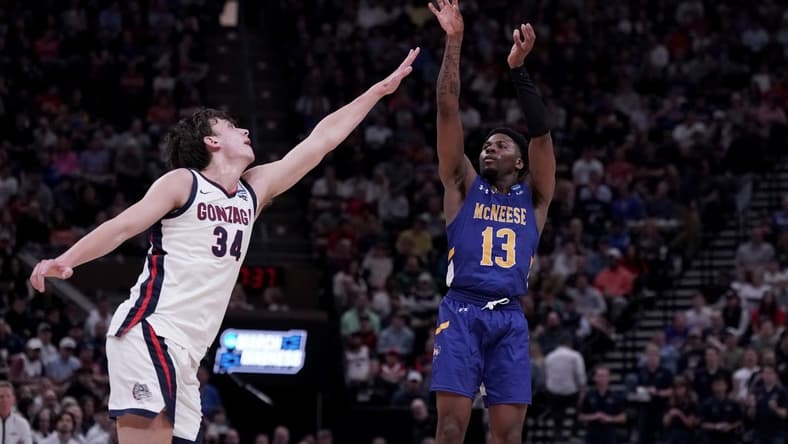 Mar 21, 2024; Salt Lake City, UT, USA; McNeese State Cowboys guard Shahada Wells (13) shoots against Gonzaga Bulldogs forward Braden Huff (34) during the second half in the first round of the 2024 NCAA Tournament at Vivint Smart Home Arena-Delta Center. Mandatory Credit: Gabriel Mayberry-USA TODAY Sports