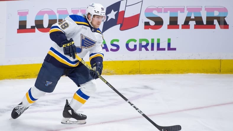 Mar 21, 2024; Ottawa, Ontario, CAN; St. Louis Blues defenseman Scott Perunovich (48) skates with the puck in the third period against the Ottawa Senators at the Canadian Tire Centre. Mandatory Credit: Marc DesRosiers-USA TODAY Sports