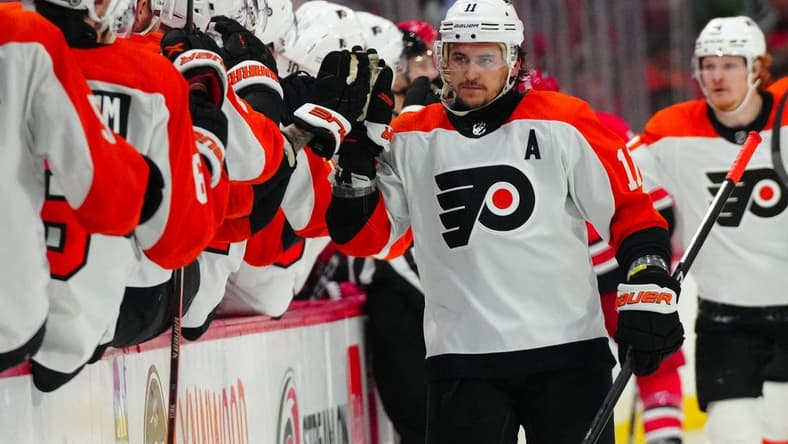 Mar 21, 2024; Raleigh, North Carolina, USA; Philadelphia Flyers right wing Travis Konecny (11) celebrates his goal against the Carolina Hurricanes during the third period at PNC Arena. Mandatory Credit: James Guillory-USA TODAY Sports