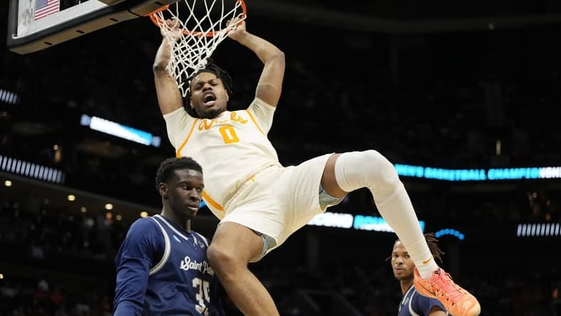 Mar 21, 2024; Charlotte, NC, USA; Tennessee Volunteers forward Jonas Aidoo (0) dunks over Saint Peter's Peacocks forward Mouhamed Sow (35) in the first half of the first round of the 2024 NCAA Tournament at Spectrum Center. Mandatory Credit: Bob Donnan-USA TODAY Sports