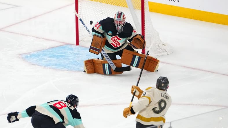 Mar 21, 2024; Las Vegas, Nevada, USA; Seattle Kraken goaltender Philipp Grubauer (31) defends his net against a shot from Vegas Golden Knights center Jack Eichel (9) during the first period at T-Mobile Arena. Mandatory Credit: Stephen R. Sylvanie-USA TODAY Sports