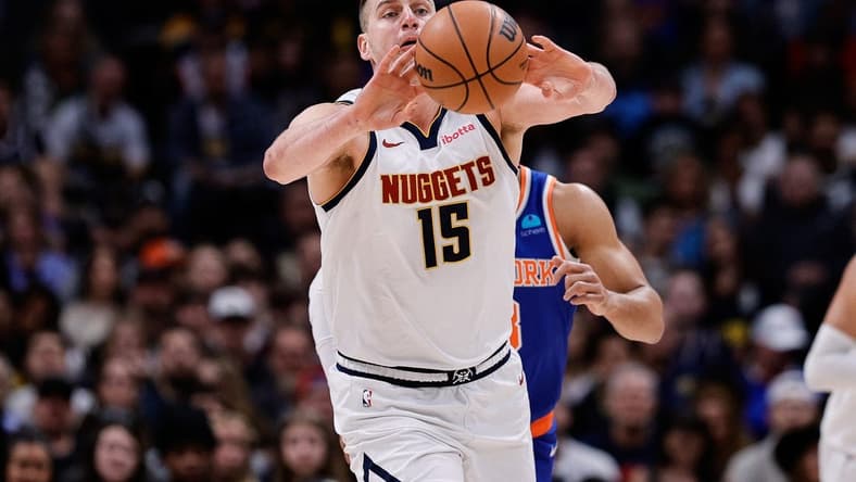 Mar 21, 2024; Denver, Colorado, USA; Denver Nuggets center Nikola Jokic (15) passes the ball in the first quarter against the New York Knicks at Ball Arena. Mandatory Credit: Isaiah J. Downing-USA TODAY Sports