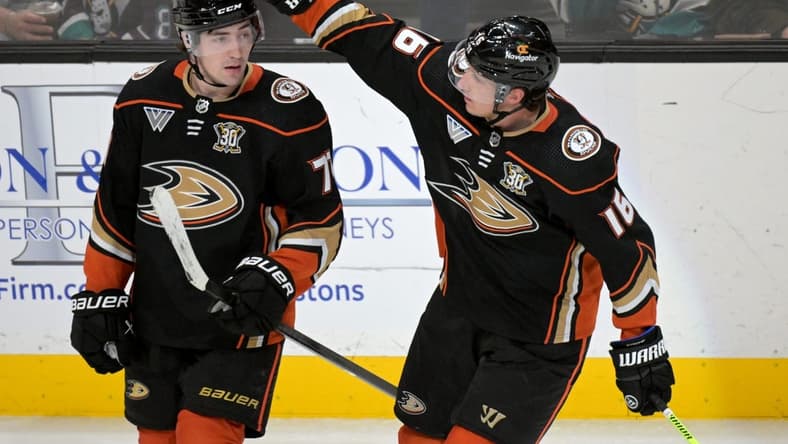 Mar 21, 2024; Anaheim, California, USA;  Anaheim Ducks right wing Frank Vatrano (77) is congratulated by center Ryan Strome (16) after scoring a goal in the third period against the Chicago Blackhawks at Honda Center. Mandatory Credit: Jayne Kamin-Oncea-USA TODAY Sports