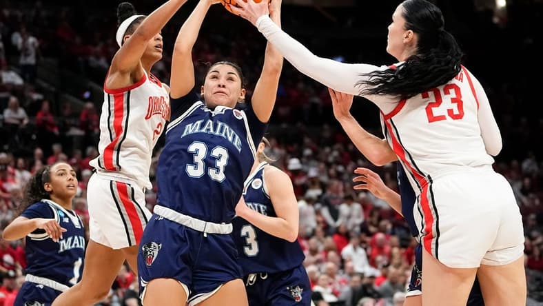 Mar 22, 2024; Columbus, OH, USA; Maine Black Bears forward Adrianna Smith (33) battles for a rebound with Ohio State Buckeyes guard Taylor Thierry (2) and forward Rebeka Mikulasikova (23) during the second half of the women’s basketball NCAA Tournament first round game at Value City Arena. Ohio State won 80-57.