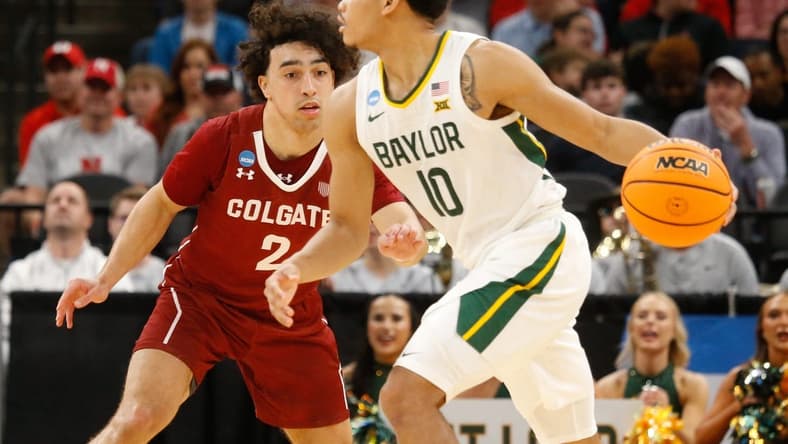 Mar 22, 2024; Memphis, TN, USA;  Baylor Bears guard RayJ Dennis (10) dribbles against Colgate Raiders guard Braeden Smith (2) during the second half of the NCAA Tournament First Round at FedExForum. Mandatory Credit: Petre Thomas-USA TODAY Sports