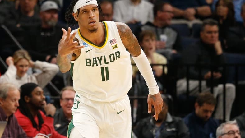 Mar 22, 2024; Memphis, TN, USA; Baylor Bears forward Jalen Bridges (11) reacts after a three-point shot against the Colgate Raiders during the second half of the NCAA Tournament First Round at FedExForum. Mandatory Credit: Petre Thomas-USA TODAY Sports