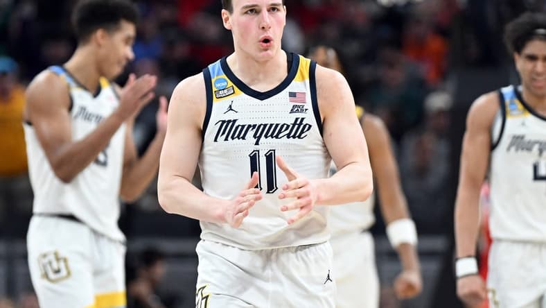 Mar 22, 2024; Indianapolis, IN, USA; Marquette Golden Eagles guard Tyler Kolek (11) reacts in the second half against the Western Kentucky Hilltoppers in the first round of the 2024 NCAA Tournament at Gainbridge FieldHouse. Mandatory Credit: Robert Goddin-USA TODAY Sports