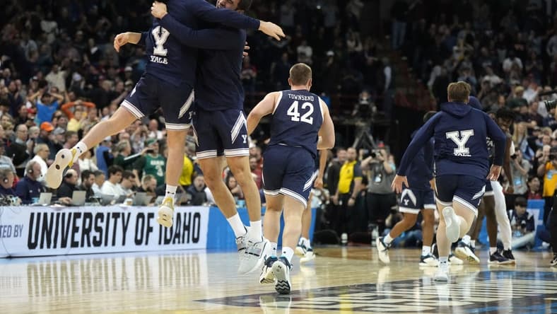 Mar 22, 2024; Spokane, WA, USA; Yale Bulldogs guard Trevor Mullin (0) celebrates with guard Emir Buyukhanli (11) after a game against the Auburn Tigers in the first round of the 2024 NCAA Tournament at Spokane Veterans Memorial Arena. Mandatory Credit: Kirby Lee-USA TODAY Sports
