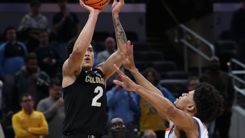 Mar 22, 2024; Indianapolis, IN, USA; Colorado Buffaloes guard KJ Simpson (2) shoots against Florida Gators guard Zyon Pullin (0) in the second half in the first round of the 2024 NCAA Tournament at Gainbridge FieldHouse. Mandatory Credit: Trevor Ruszkowski-USA TODAY Sports