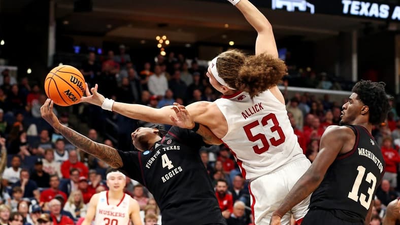 Mar 22, 2024; Memphis, TN, USA;  Texas A&M Aggies guard Wade Taylor IV (4) and Nebraska Cornhuskers forward Josiah Allick (53) go for the ball during the second half in the first round of the 2024 NCAA Tournament at FedExForum. Mandatory Credit: Petre Thomas-USA TODAY Sports