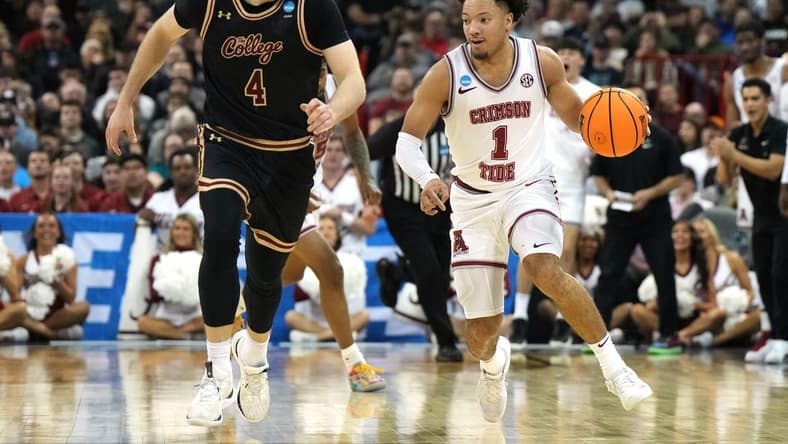 Mar 22, 2024; Spokane, WA, USA; Alabama Crimson Tide guard Mark Sears (1) dribbles against Charleston Cougars guard Bryce Butler (4) during the first half in the first round of the 2024 NCAA Tournament at Spokane Veterans Memorial Arena. Mandatory Credit: Kirby Lee-USA TODAY Sports