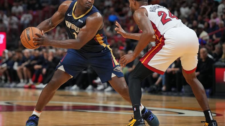 Mar 22, 2024; Miami, Florida, USA;  New Orleans Pelicans forward Zion Williamson (1) brings the ball up the court as Miami Heat forward Haywood Highsmith (24) during the first half at Kaseya Center. Mandatory Credit: Jim Rassol-USA TODAY Sports