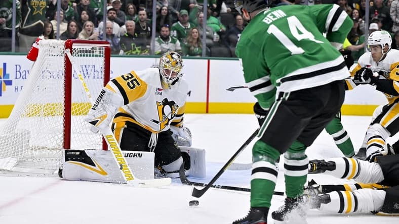 Mar 22, 2024; Dallas, Texas, USA; Dallas Stars left wing Jamie Benn (14) scores a goal against Pittsburgh Penguins goaltender Tristan Jarry (35) during the second period at the American Airlines Center. Mandatory Credit: Jerome Miron-USA TODAY Sports