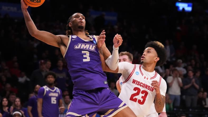 Mar 22, 2024; Brooklyn, NY, USA; James Madison Dukes forward T.J. Bickerstaff (3) shoots the ball over Wisconsin Badgers guard Chucky Hepburn (23) in the first round of the 2024 NCAA Tournament at the Barclays Center. Mandatory Credit: Robert Deutsch-USA TODAY Sports