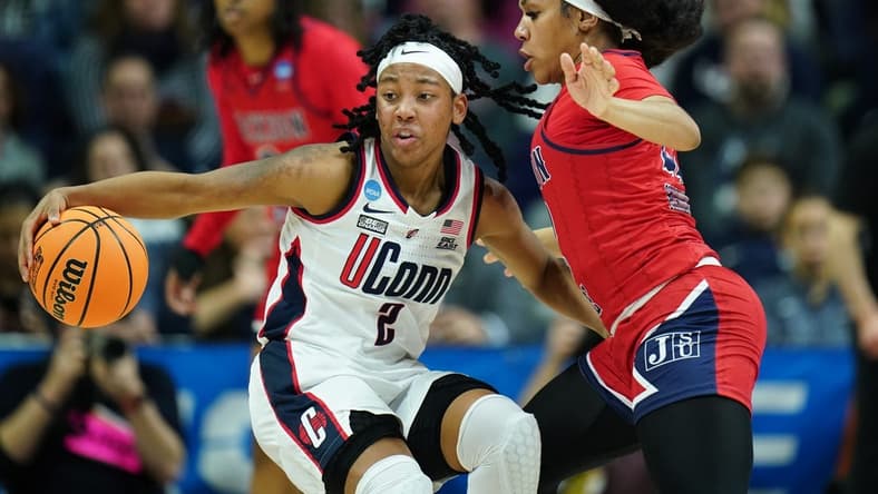 Mar 23, 2024; Storrs, Connecticut, USA; UConn Huskies guard KK Arnold (2) moves the ball against Jackson State Lady Tigers guard Zakiya Mahoney (22) in the second half at Harry A. Gampel Pavilion. Mandatory Credit: David Butler II-USA TODAY Sports
