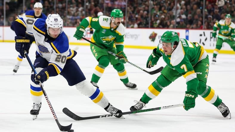 Mar 23, 2024; Saint Paul, Minnesota, USA; St. Louis Blues left wing Brandon Saad (20) skates around Minnesota Wild defenseman Brock Faber (7) during the second period at Xcel Energy Center. Mandatory Credit: Matt Krohn-USA TODAY Sports