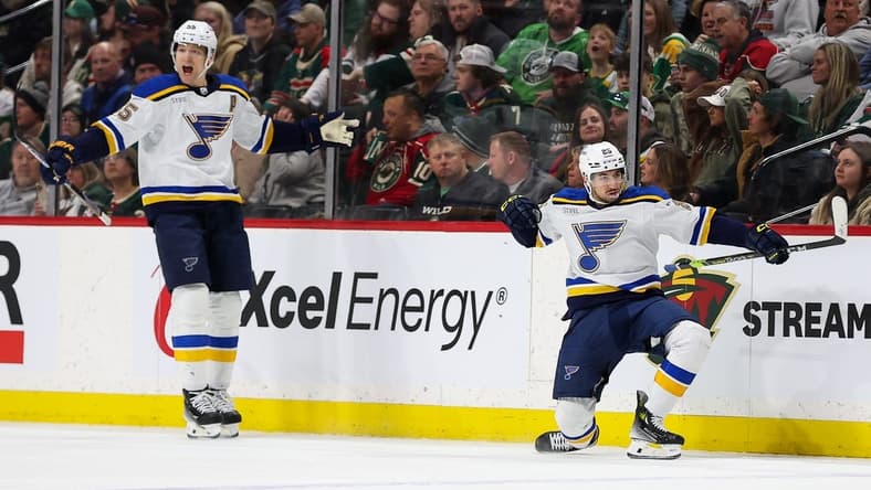Mar 23, 2024; Saint Paul, Minnesota, USA; St. Louis Blues center Jordan Kyrou (25) celebrates his hat-trick against the Minnesota Wild during the third period at Xcel Energy Center. Mandatory Credit: Matt Krohn-USA TODAY Sports
