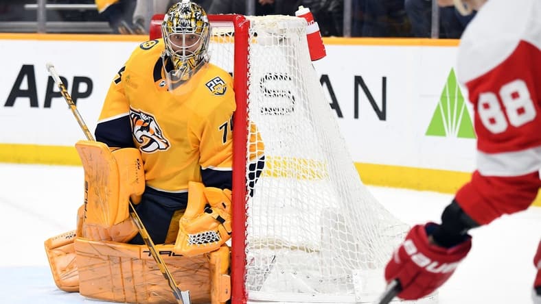 Mar 23, 2024; Nashville, Tennessee, USA; Nashville Predators goaltender Juuse Saros (74) watches as Detroit Red Wings right wing Patrick Kane (88) handles the puck in the corner during the second period at Bridgestone Arena. Mandatory Credit: Christopher Hanewinckel-USA TODAY Sports