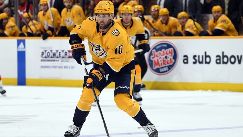 Mar 23, 2024; Nashville, Tennessee, USA; Nashville Predators left wing Jason Zucker (16) skates the puck into the offensive zone during the third period against the Detroit Red Wings at Bridgestone Arena. Mandatory Credit: Christopher Hanewinckel-USA TODAY Sports