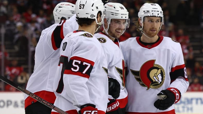 Mar 23, 2024; Newark, New Jersey, USA; Ottawa Senators right wing Drake Batherson (19) celebrates his goal against the New Jersey Devils during the third period at Prudential Center. Mandatory Credit: Ed Mulholland-USA TODAY Sports