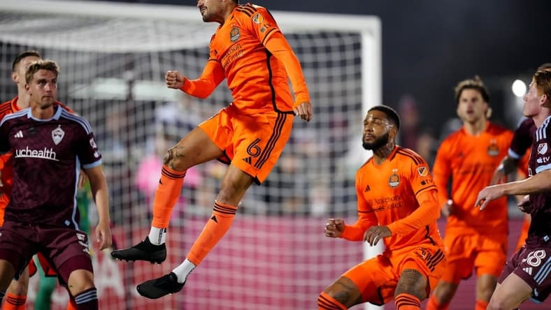 Mar 23, 2024; Commerce City, Colorado, USA; Houston Dynamo FC midfielder Artur (6) heads the ball in front of the Colorado Rapids goal during the first half at Dick's Sporting Goods Park. Mandatory Credit: Ron Chenoy-USA TODAY Sports