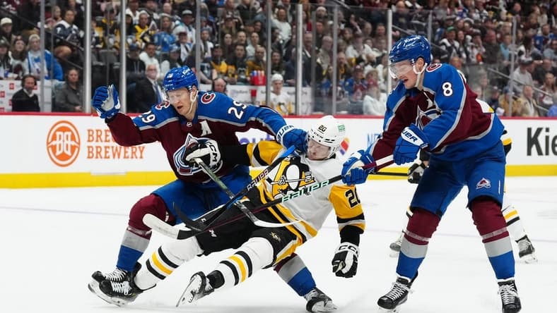 Mar 24, 2024; Denver, Colorado, USA; Colorado Avalanche center Nathan MacKinnon (29) and Colorado Avalanche defenseman Cale Makar (8) defend on Pittsburgh Penguins center Lars Eller (20) in the first period at Ball Arena. Mandatory Credit: Ron Chenoy-USA TODAY Sports