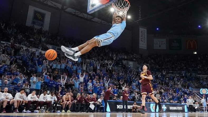 Indiana State Sycamores guard Julian Larry (1) dunks the ball Sunday, March 24, 2024, during the second round of the NIT at the Hulman Center in Terre Haute. The Indiana State Sycamores defeated the Minnesota Golden Gophers, 76-64.