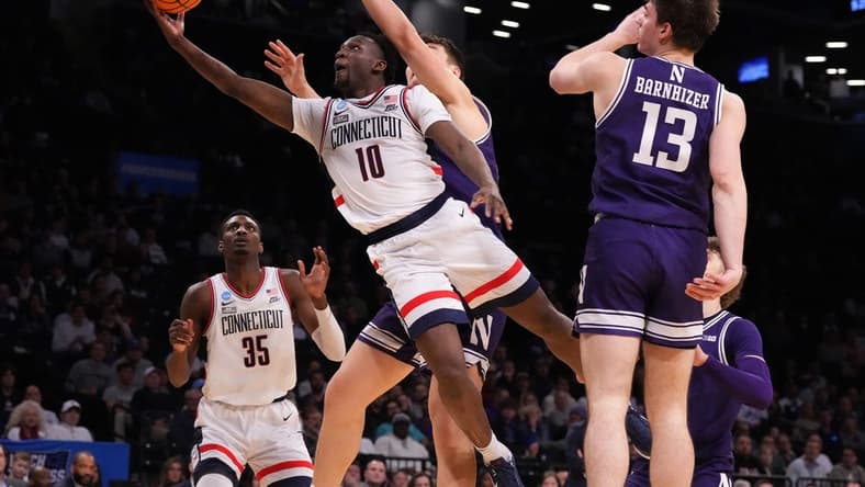 Mar 24, 2024; Brooklyn, NY, USA; Connecticut Huskies guard Hassan Diarra (10) shoots the ball against the Northwestern Wildcats in the second round of the 2024 NCAA Tournament at the Barclays Center. Mandatory Credit: Robert Deutsch-USA TODAY Sports