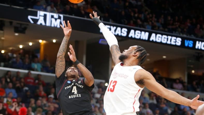 Texas A&M's Wade Taylor IV (4) shoots the ball during the second round game between Texas A&M and the University of Houston in the 2024 NCAA Tournament at FedExForum in Memphis, Tenn., on Sunday, March 24, 2024.