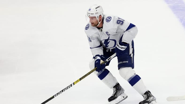 Mar 24, 2024; Anaheim, California, USA; Tampa Bay Lightning center Steven Stamkos (91) skates with the puck during overtime against the Anaheim Ducks at Honda Center. Mandatory Credit: Jason Parkhurst-USA TODAY Sports