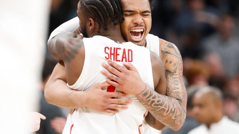 Houston's Jamal Shead (1) and Ramon Walker Jr. (3) celebrate after Houston defeated Texas A&M 100-95 in overtime in the second round of the 2024 NCAA Tournament at FedExForum in Memphis, Tenn., on Sunday, March 24, 2024.