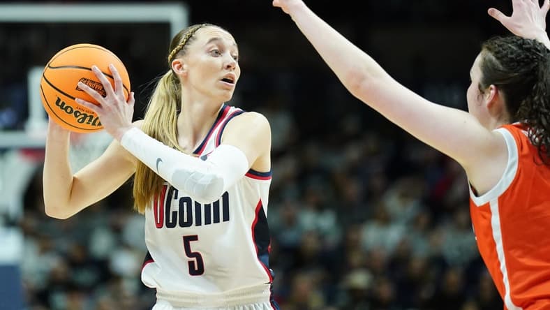 Mar 25, 2024; Storrs, Connecticut, USA; UConn Huskies guard Paige Bueckers (5) looks for an opening against the Syracuse Orange in the first half at Harry A. Gampel Pavilion. Mandatory Credit: David Butler II-USA TODAY Sports