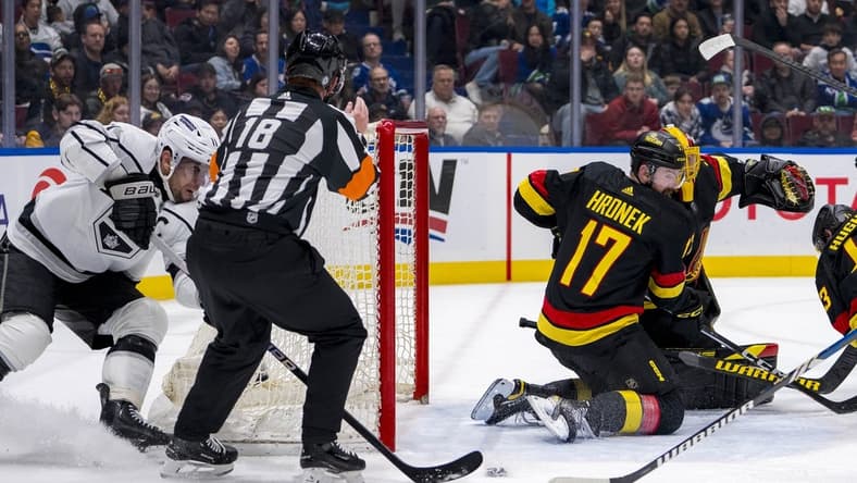 Mar 25, 2024; Vancouver, British Columbia, CAN; Vancouver Canucks defenseman Filip Hronek (17) watches as Los Angeles Kings forward Anze Kopitar (11) scores on goalie Casey DeSmith (29) in the second period at Rogers Arena. Mandatory Credit: Bob Frid-USA TODAY Sports